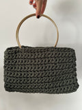 Bolso verde montaña con asa dorada